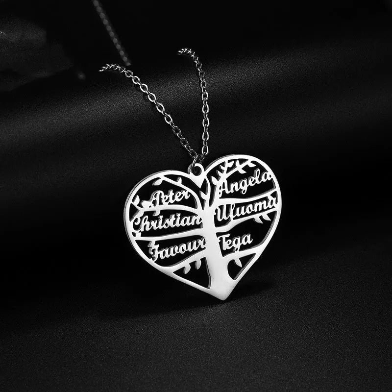 Personalised name necklace with hollow heart and tree pendant in silver, gold, or rose gold on a metal chain.