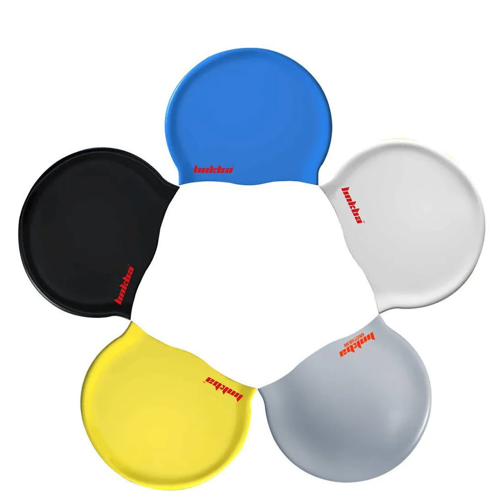 Silicone swimming cap with waterproof earmuffs in multiple colours on a blue background.