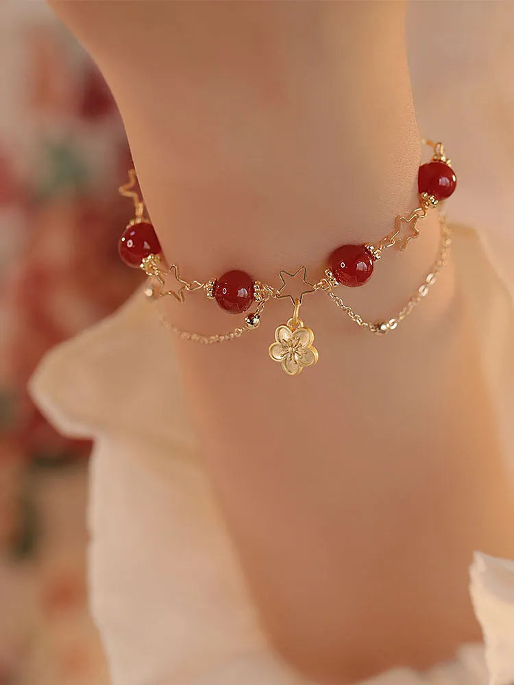 Handmade double layer red agate bracelet with peach blossom and flower design for women.