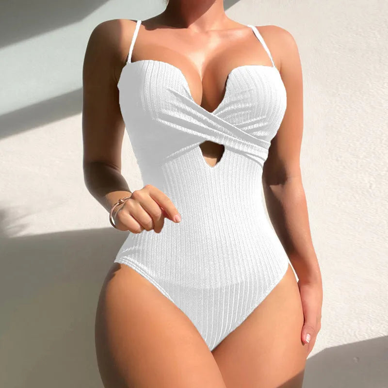 Solid colour one-piece swimsuit for women in polyester, shown in burgundy colour on a size mannequin.