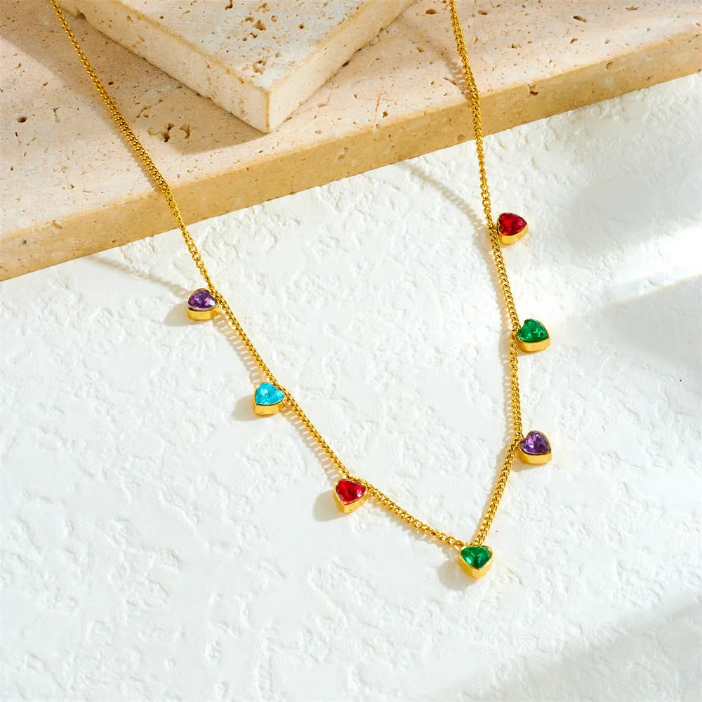 Women's gold-plated heart necklace on adjustable stainless steel chain showing love design element