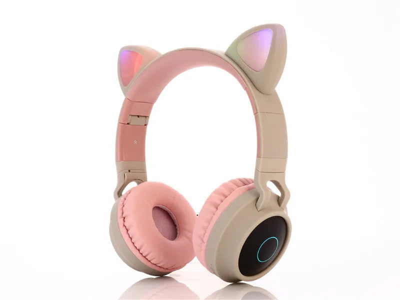 Pink cartoon cat ear wireless Bluetooth headset with headband, shown on a white background.
