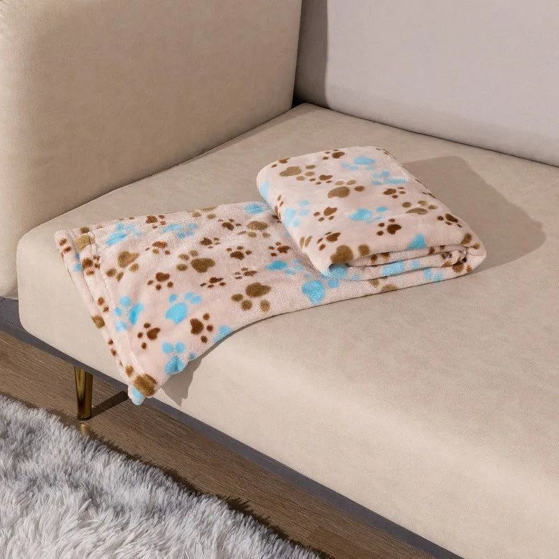 Blue cartoon dog pattern double-sided flannel pet blanket shown in a dog crate.