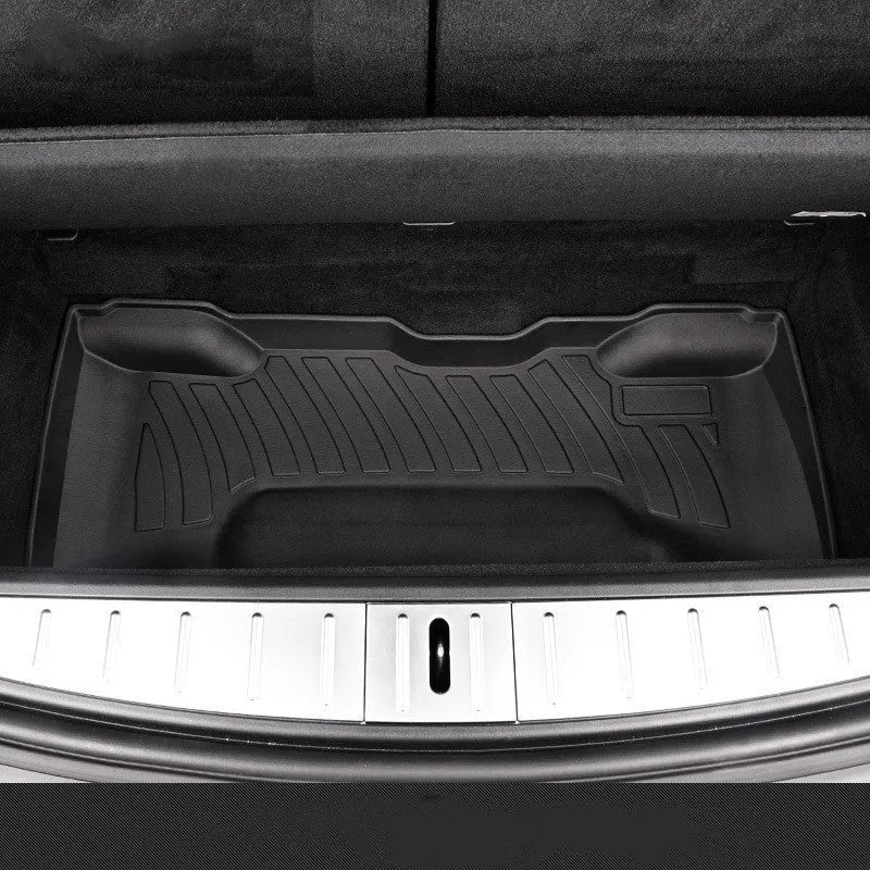 Custom rubber floor mats for Tesla cars with a textured TPE driver footrest section.