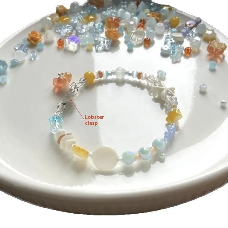 Orange sea colour alloy bracelet with diamond-shaped charms and round decorative elements for women