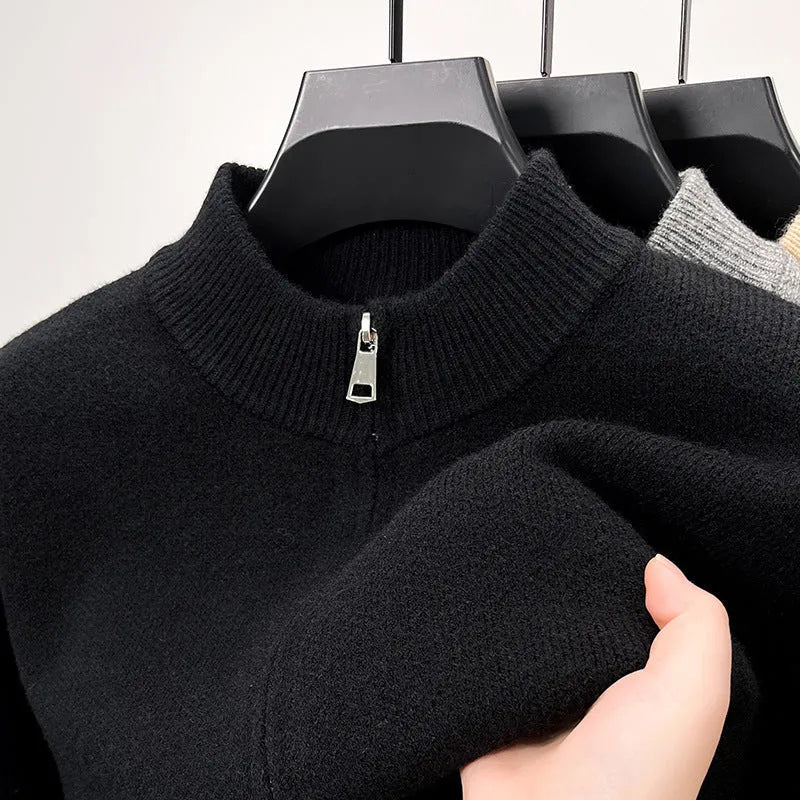 Man wearing a beige high collar zip-front knit cardigan, loose fit, long sleeves.