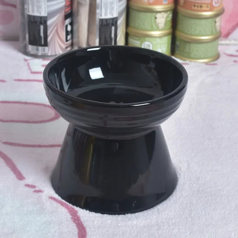 A white ceramic pet bowl with a high foot and raised neck protector to prevent tipping.