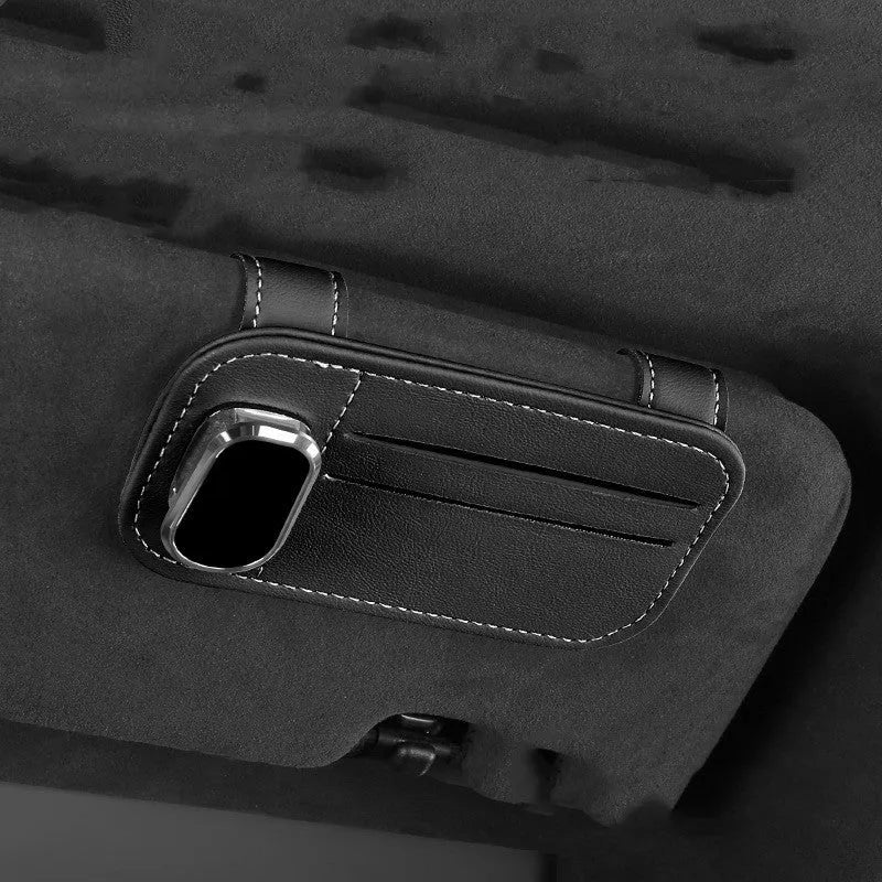 Cowhide leather card holder clipped onto a car sun visor in a choice of colours.