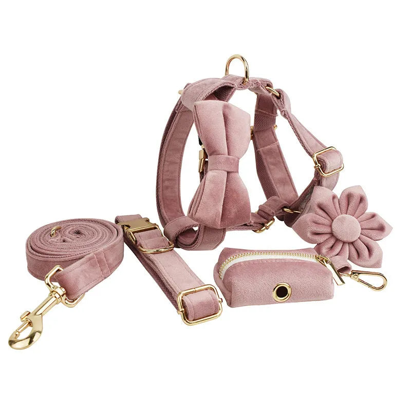 Light purple pink velvet dog collar and accessories set showing multiple pieces including collar, leash, bow tie, and vest