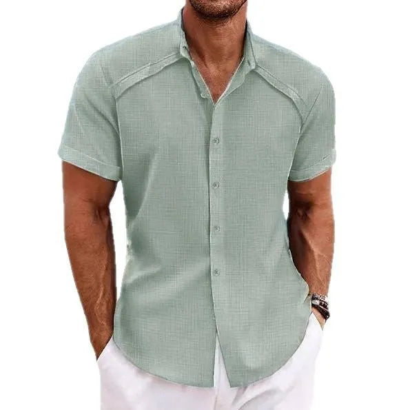 Hawaiian casual short sleeve solid colour shirt in a cotton blend fabric on a hanger.