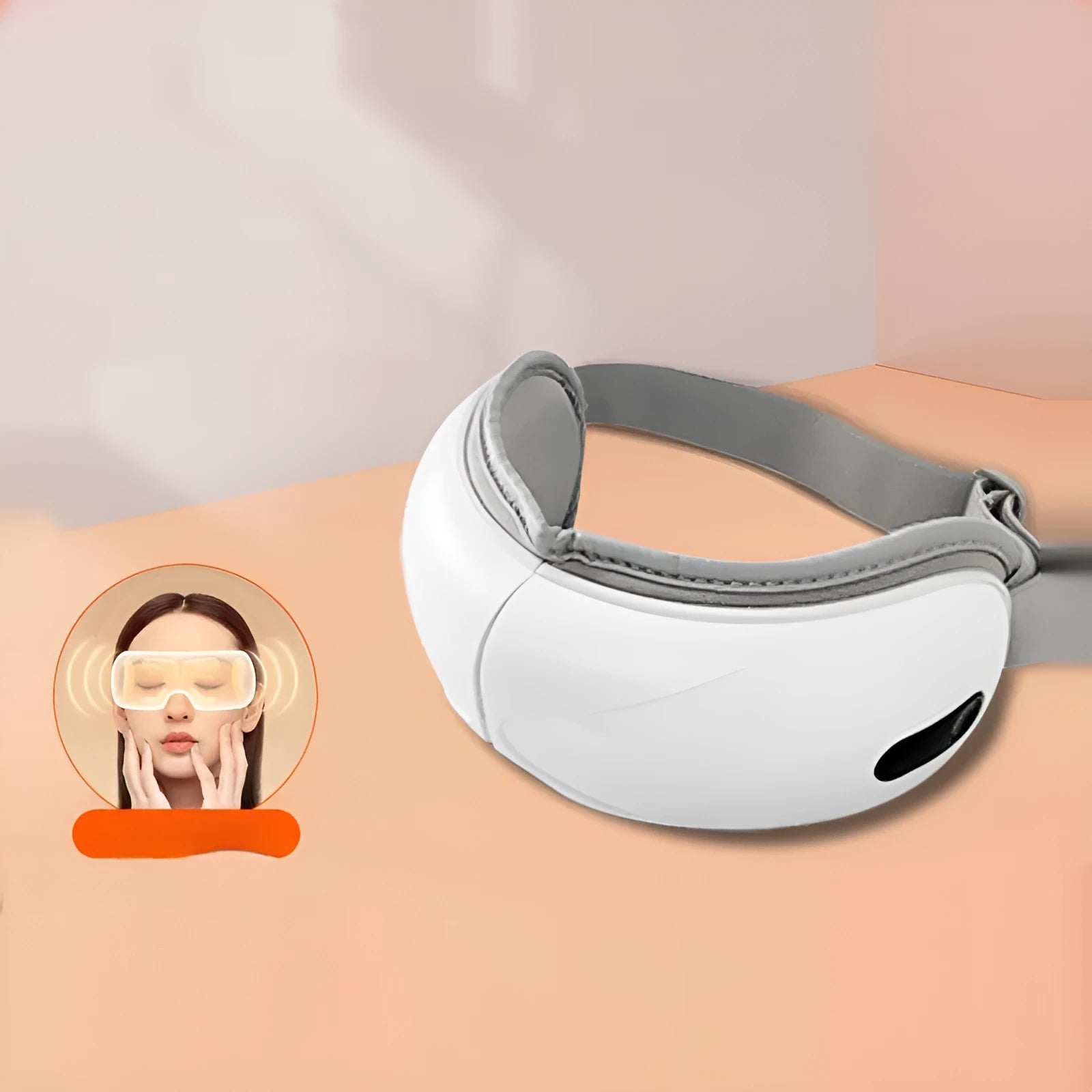 White portable electric eye massager with hot compress and airbag massage functions on a plain background