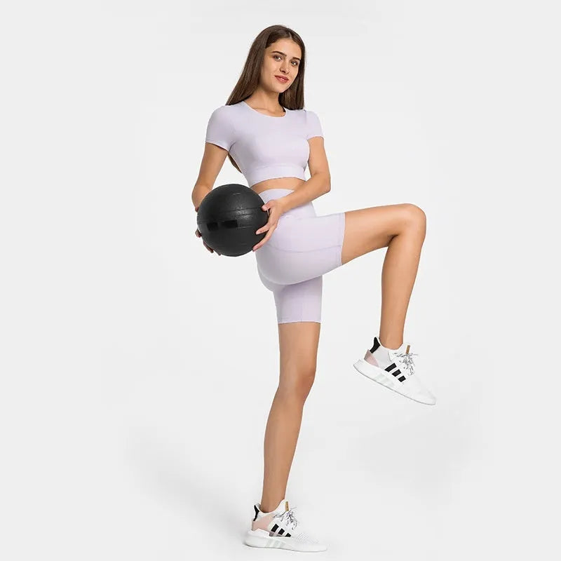 Women's black cotton blend super stretch sports shorts with mid-rise waist and short length.