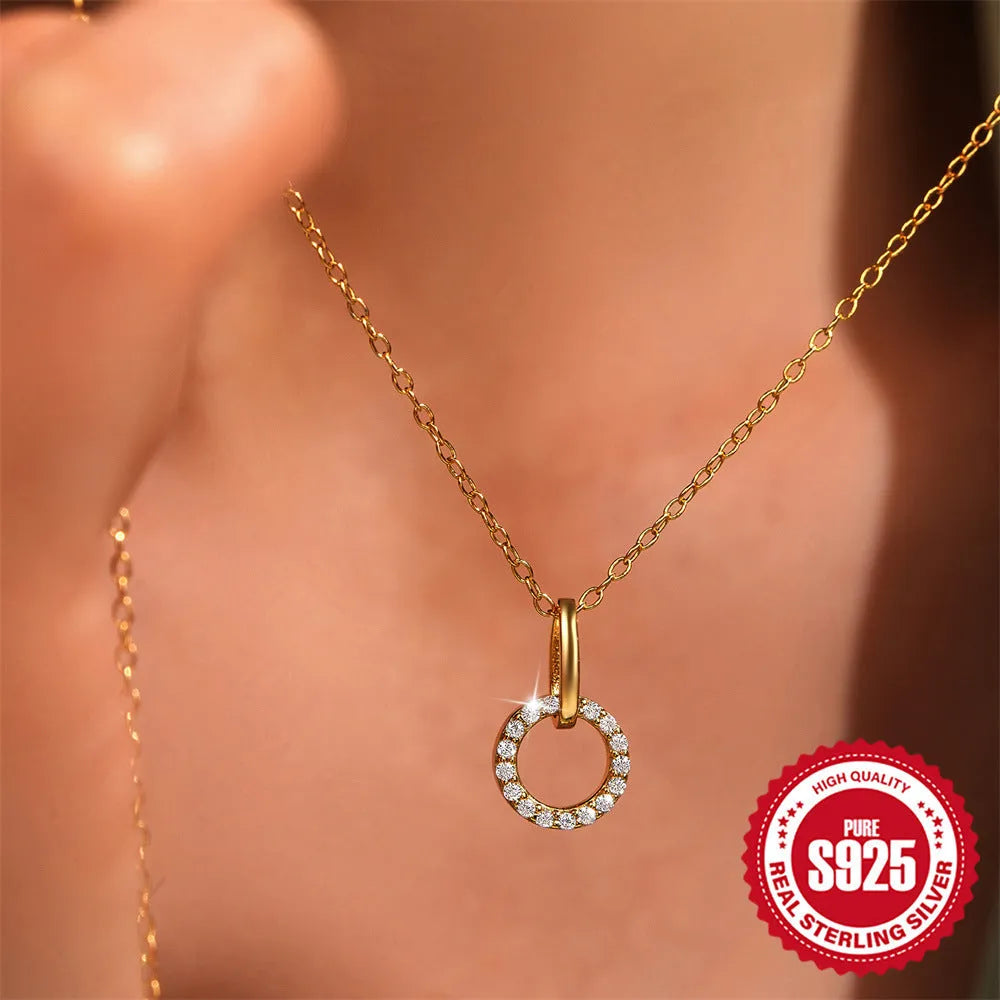 Gold-coloured geometric pendant on adjustable sterling silver clavicle chain necklace
