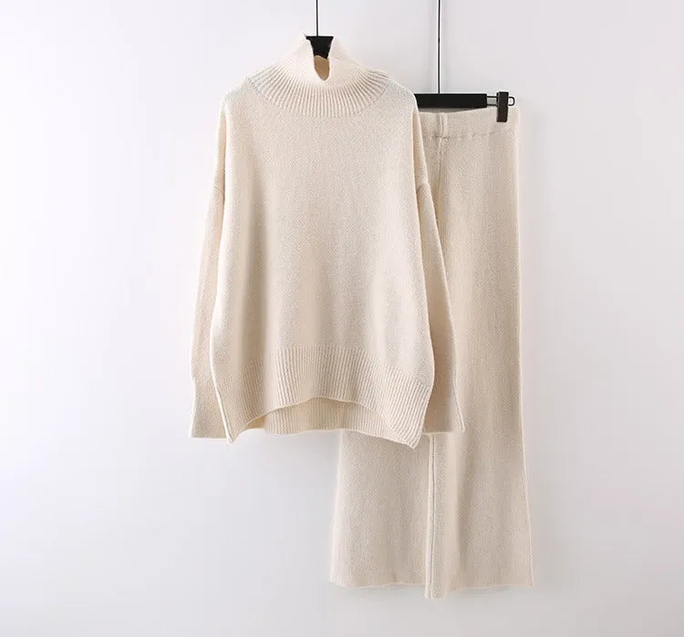 Women's beige acrylic sweater and wide-leg pants two-piece set laid flat.
