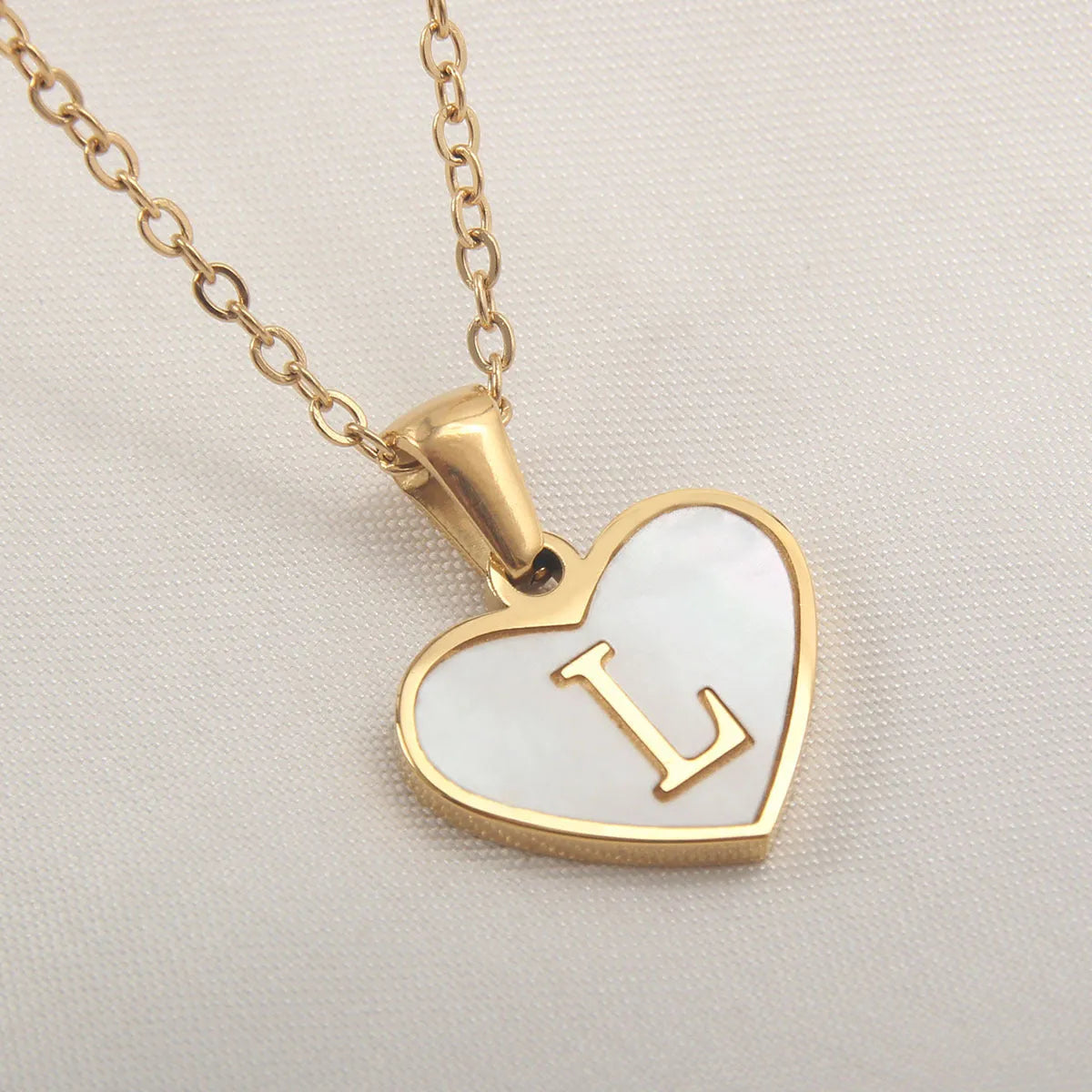 Gold plated personalised heart necklace with white shell on a 45cm chain