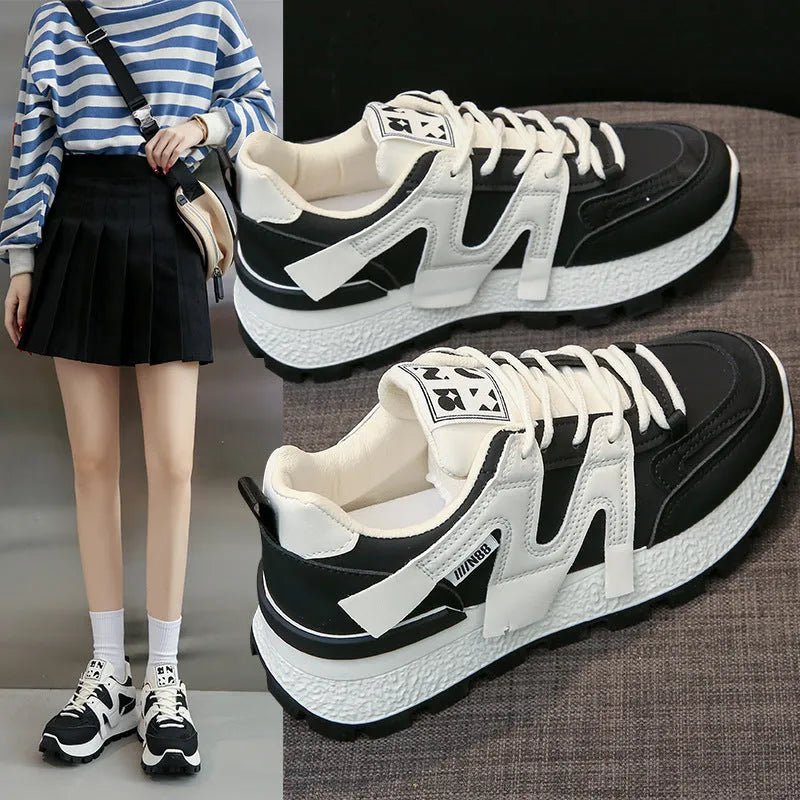 Low-top lace-up sneakers with artificial PU upper and rubber sole in black or white colour