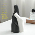 Ceramic shaped double vase in cream colour for Nordic home decoration on shelf