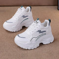 Women's white and beige dad shoes with cross straps and height increasing insoles