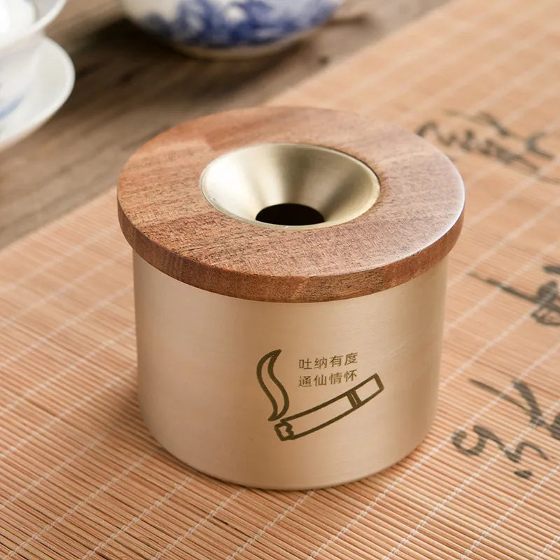 Brass retro ashtray with wooden lid in copper finish on living room table