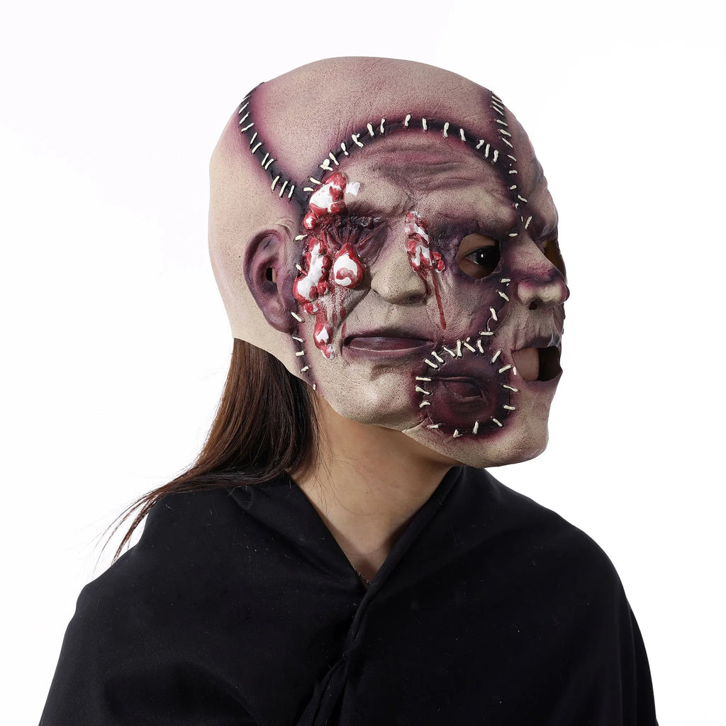 Three-sided grimace horror mask showing three distinct grotesque faces in natural latex