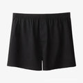 Men's solid-colour cotton boxer shorts with a high-waist, loose fit on a neutral background.
