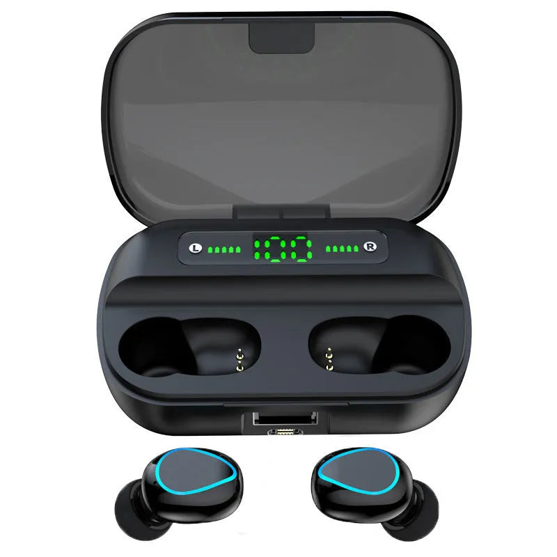 Wireless Bluetooth headset in black with earbuds and charging cable on a desk