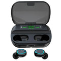 Wireless Bluetooth headset in black with earbuds and charging cable on a desk