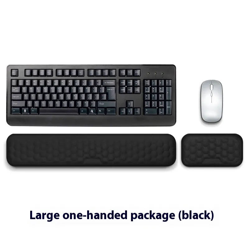 Customisable memory foam mouse wrist pad with black cloth cover on a desk.