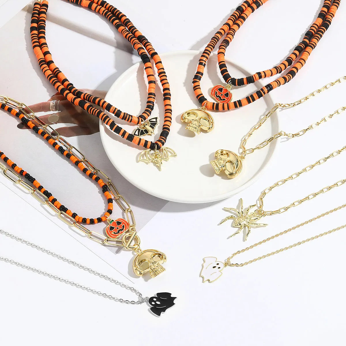 Halloween necklace with bat, ghost and skull pendants on bamboo chain