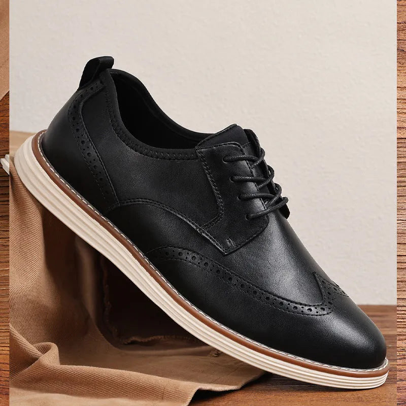 Men's black slip-on business casual shoes with round toe and decorative carving details