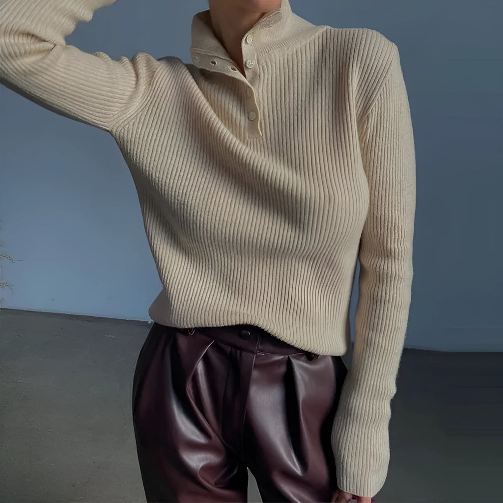 Women's silver grey slim fit pullover sweater with a half turtleneck and single-breasted placket on a hanger.
