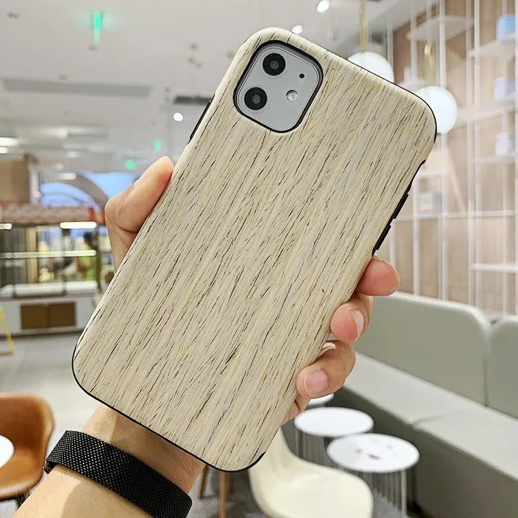 A slim wooden back cover case for an iPhone, showing the natural grain of rosewood or bamboo.