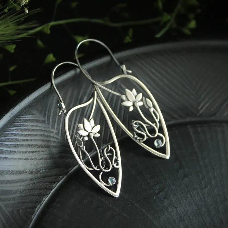 Silver electroplated lotus vine earrings with floral design and geometric round elements
