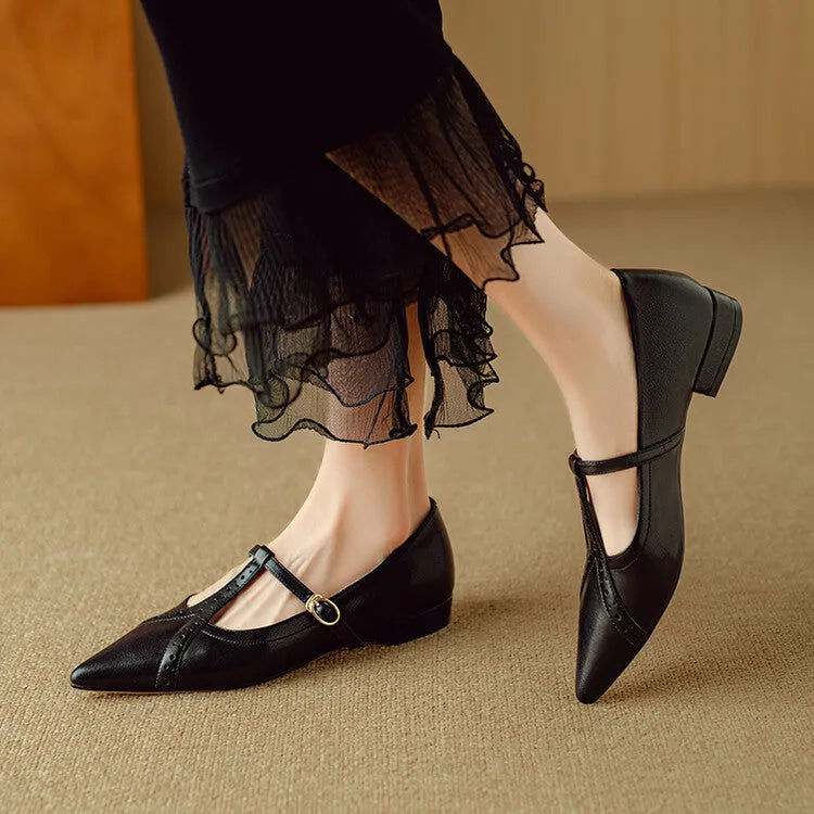 Brown women's casual cowhide flat shoes with round toe and soft bottom, shown with a skirt.