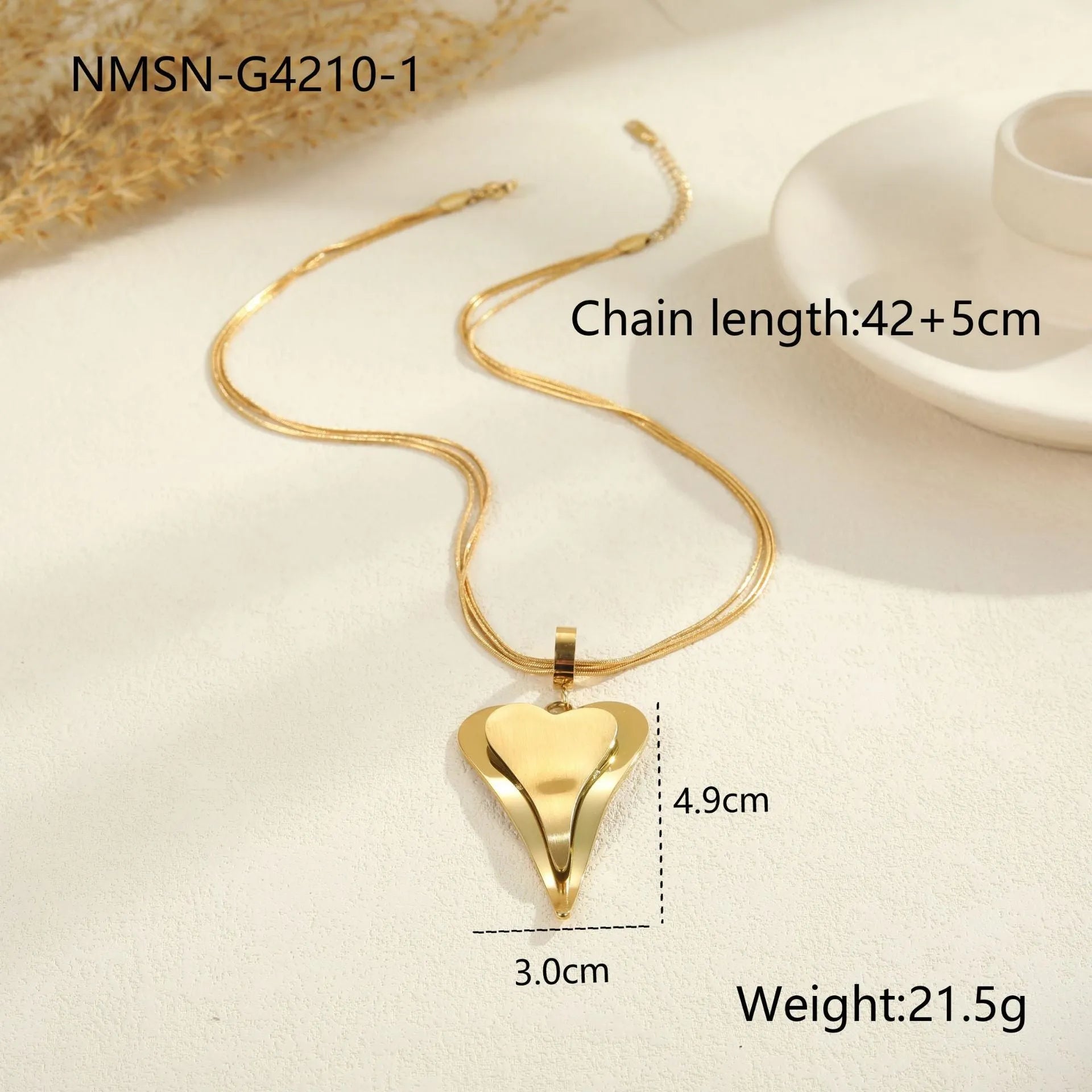Double heart geometric pendant necklace with snake bones chain in stainless steel, shown in gold and steel colour options.