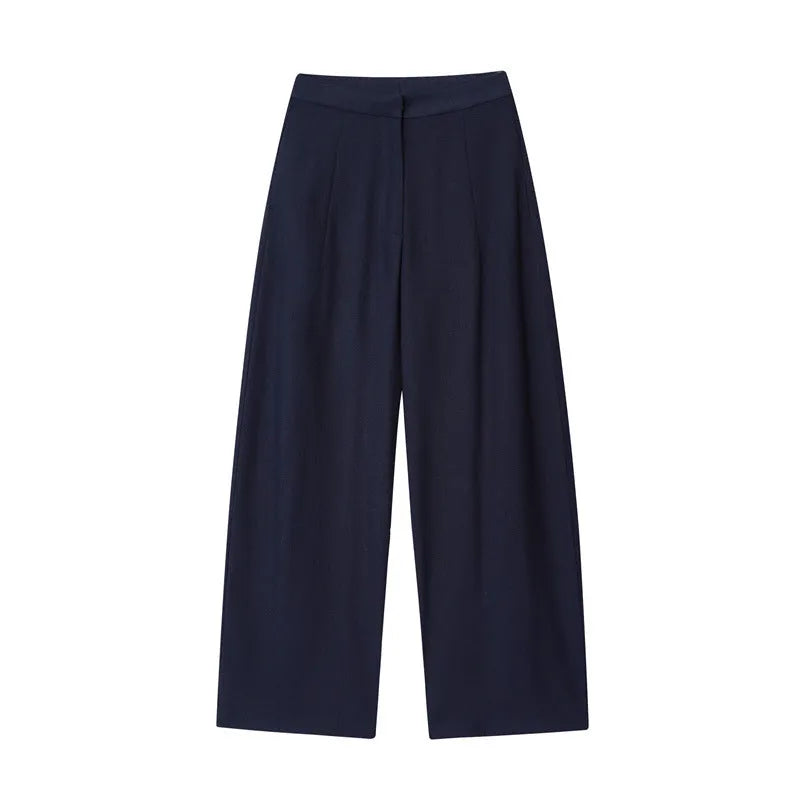 Women's linen blend co-ord suit with flounced sleeve top and wide leg trousers.