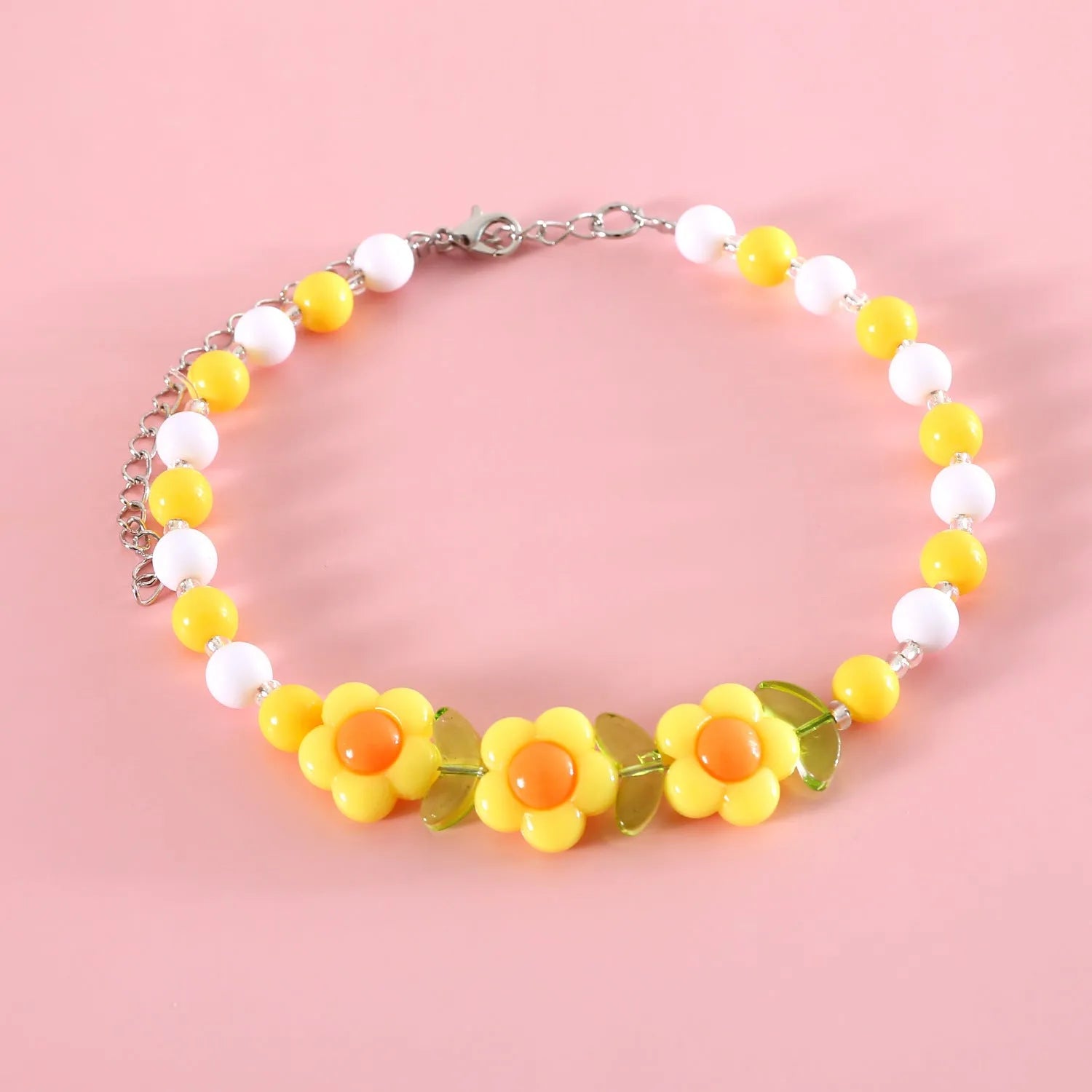 Colourful plastic bead cat necklace adjustable for pet wear in rainbow, peach, or small flower patterns