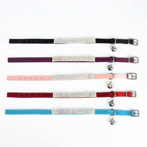 Velvet suede cat collar with rhinestone decoration in various colours on a white background.