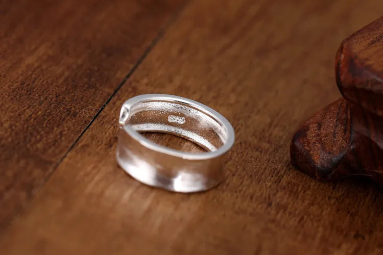 Korean frosted sterling silver geometric open ring with adjustable size on display