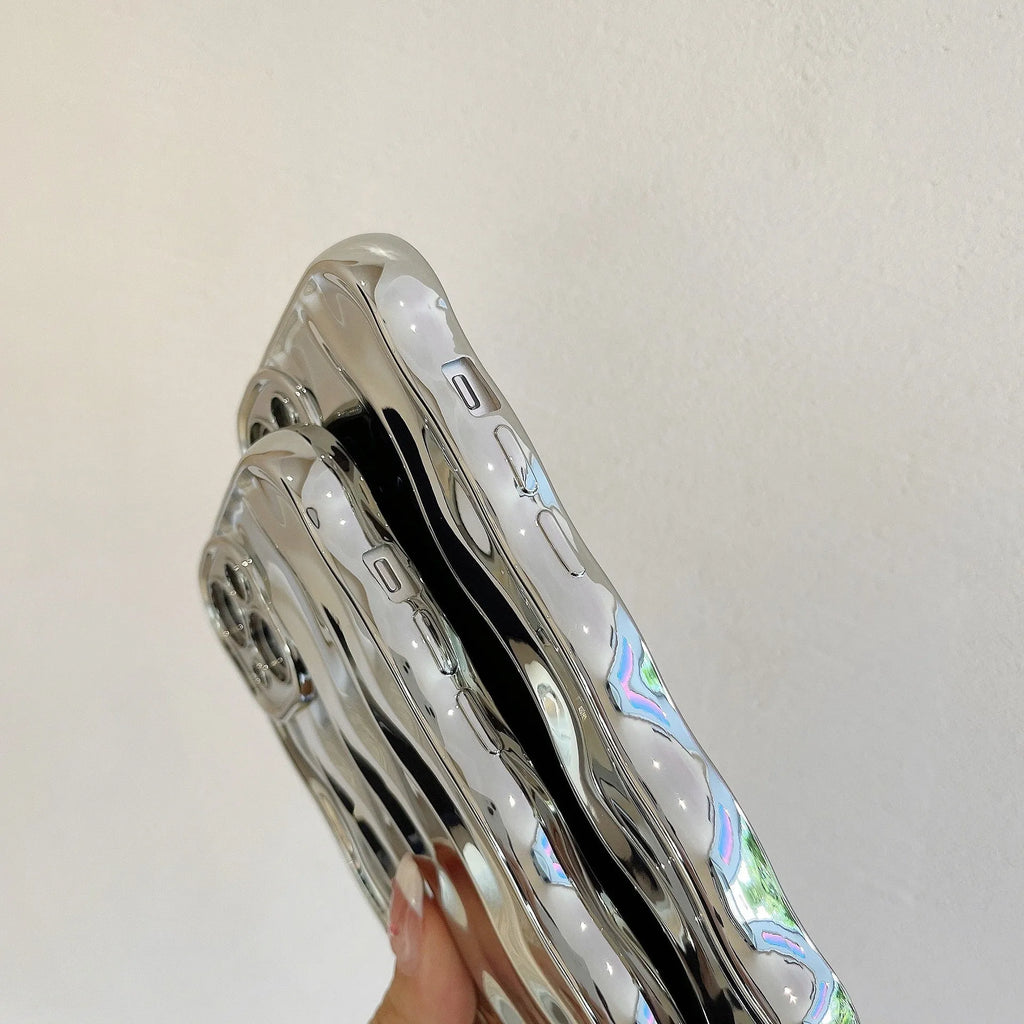 Electroplated three-dimensional wave stripe protective case for iPhone 17 on a table.