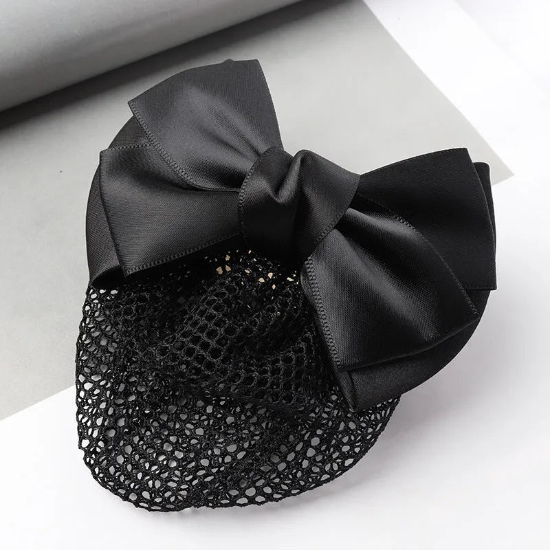 Professional hair clip with a black net pocket and a red flower bow ornament on a white background.