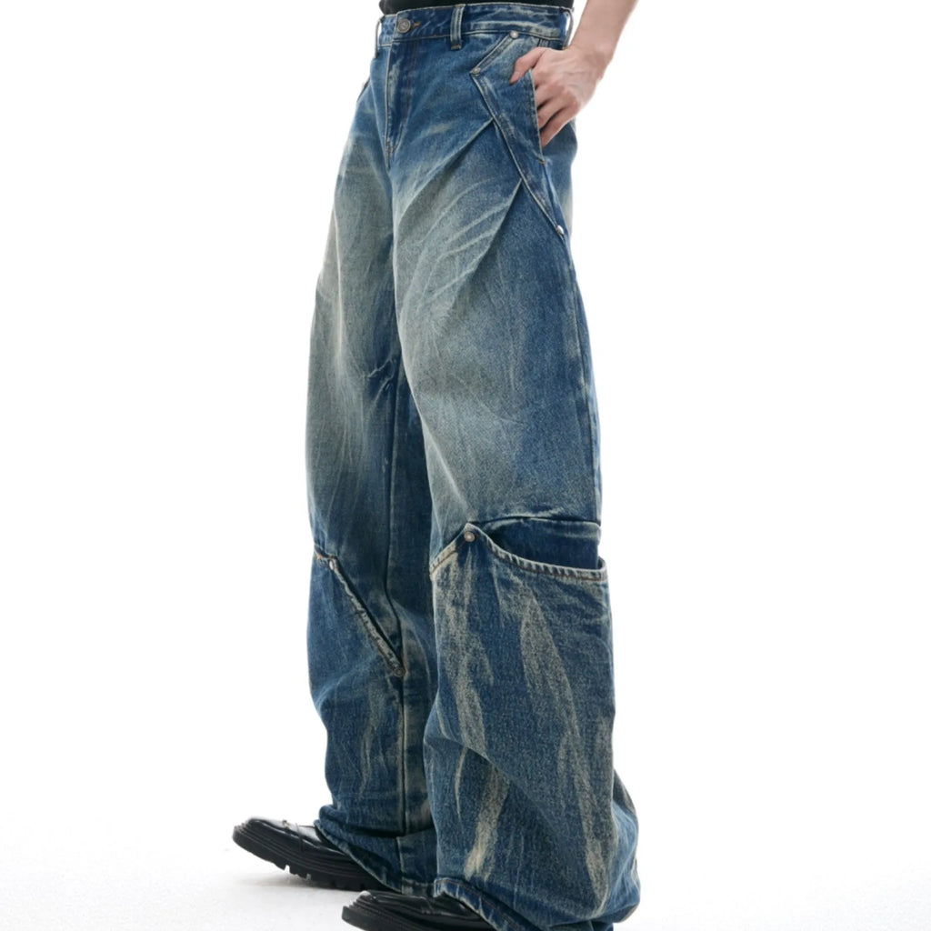 Men's verdant blue loose fit jeans with retro washed finish and curved knife design detail