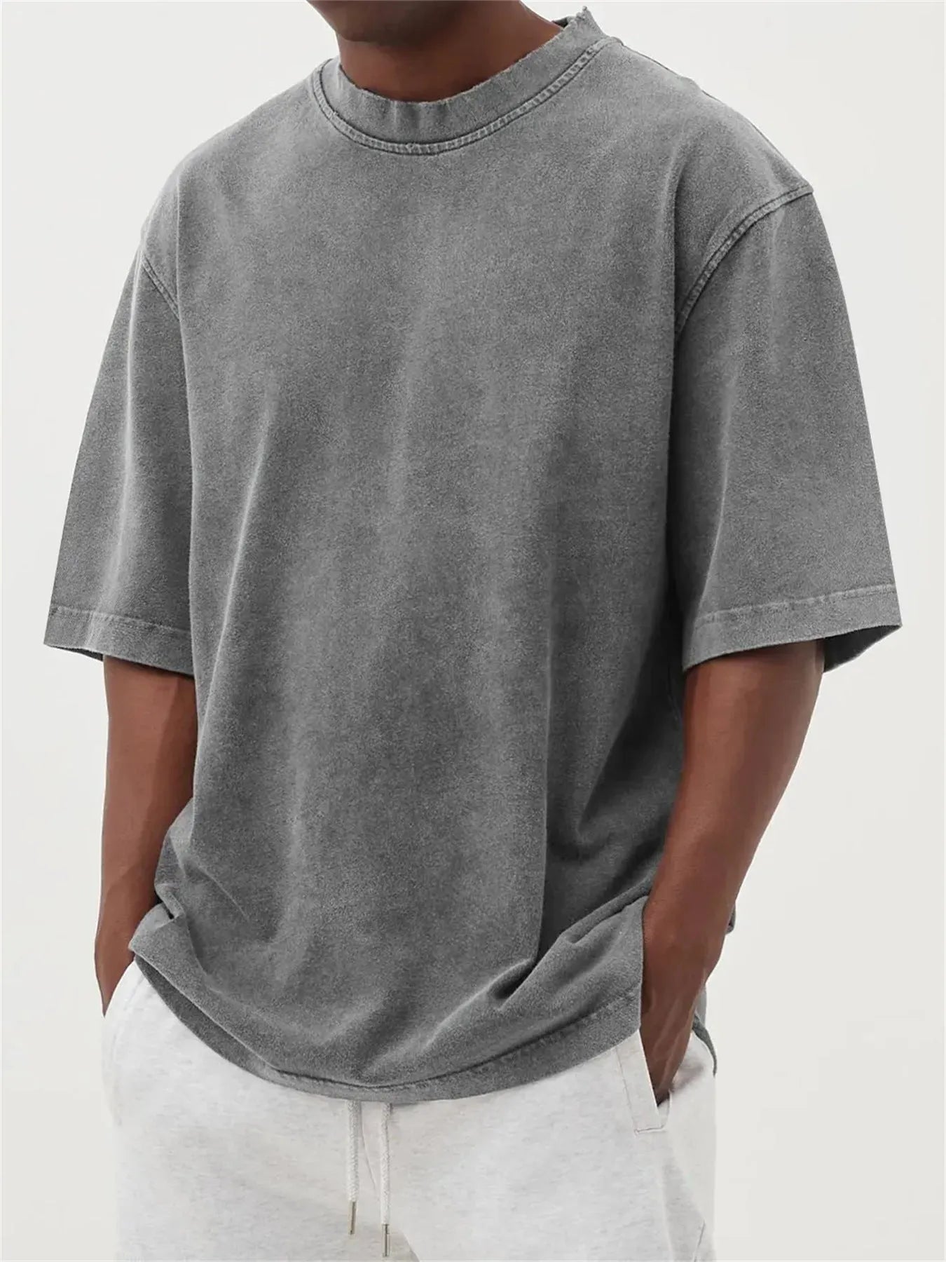 Men's loose fit distressed stone wash pullover t-shirt in solid colours like army green and blue.