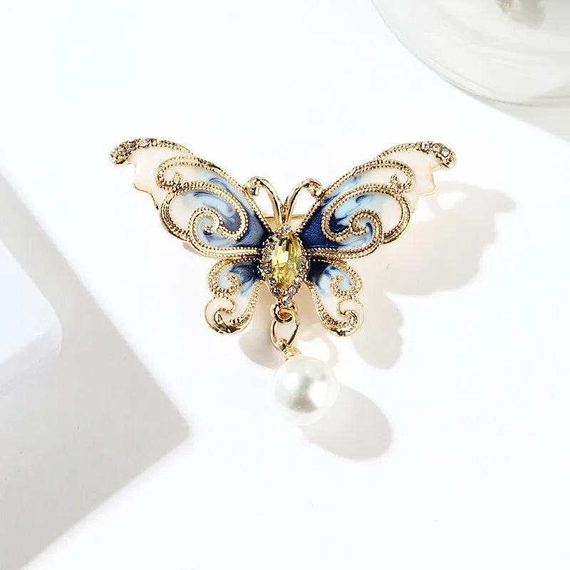European and American style butterfly brooch in zinc alloy with artificial gems in blue, green, and red colours