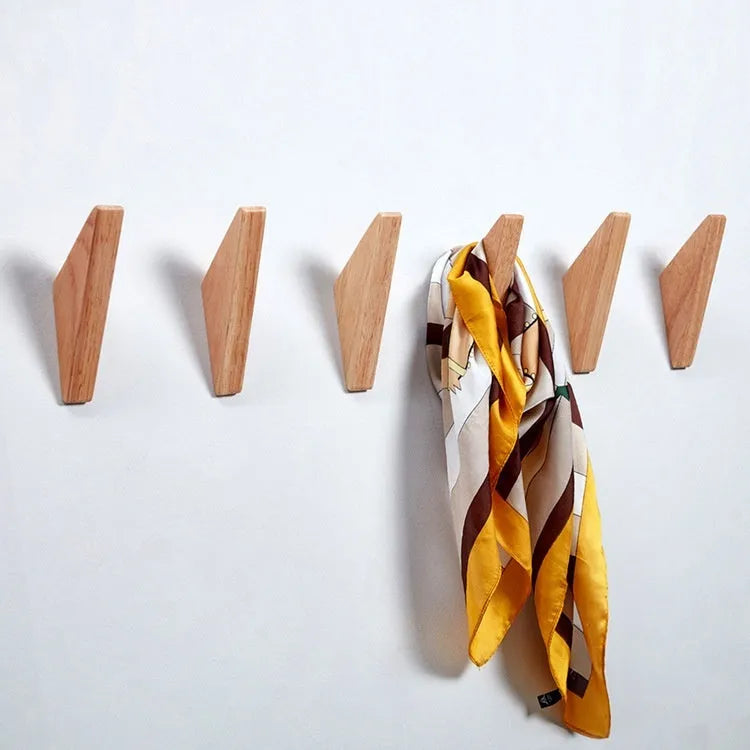Triangle rubber wood wall hook with modern minimalist design for hanging coats and bags
