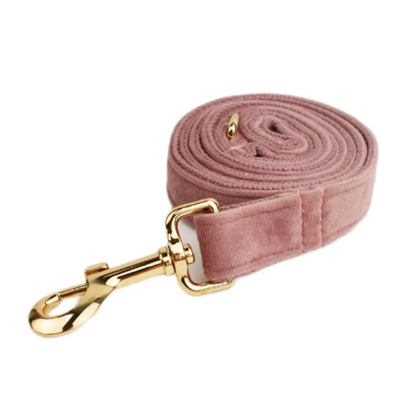 Light purple pink velvet dog collar and accessories set showing multiple pieces including collar, leash, bow tie, and vest