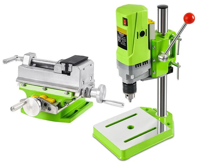 Mini bench drill milling machine with cross bench pliers on workbench