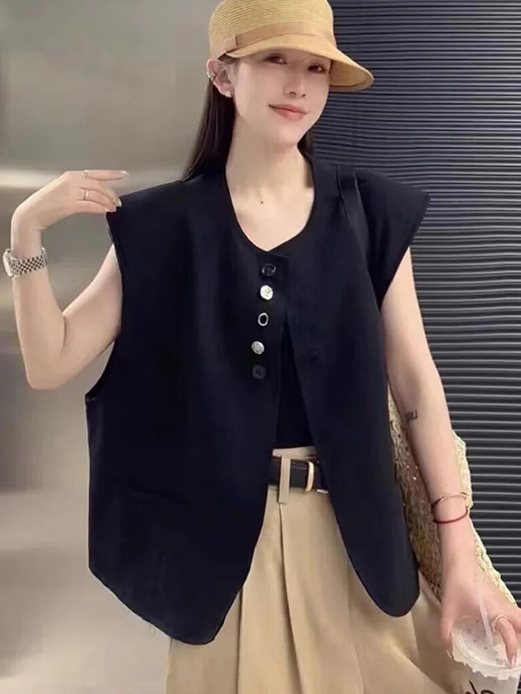 Women's loose-fit short-length polyester vest in milky white colour with front pockets.