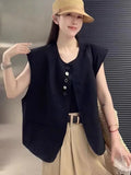 Women's loose-fit short-length polyester vest in milky white colour with front pockets.