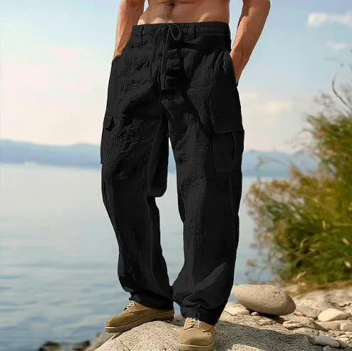 Men's loose fit thin cotton wide-leg casual trousers in a solid colour on a hanger.